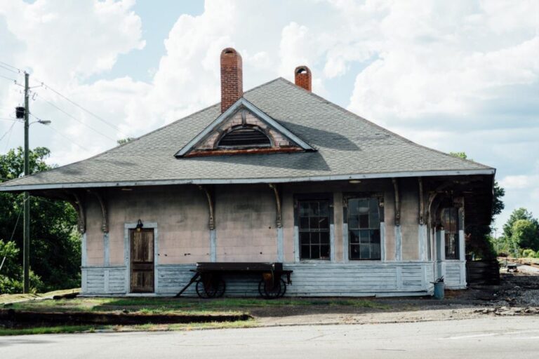 Side view of the historic Eastman railroad depot with its deep overhanging eaves