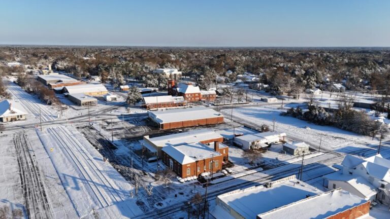 Aerial view of snow-covered rooftops across downtown Eastman
