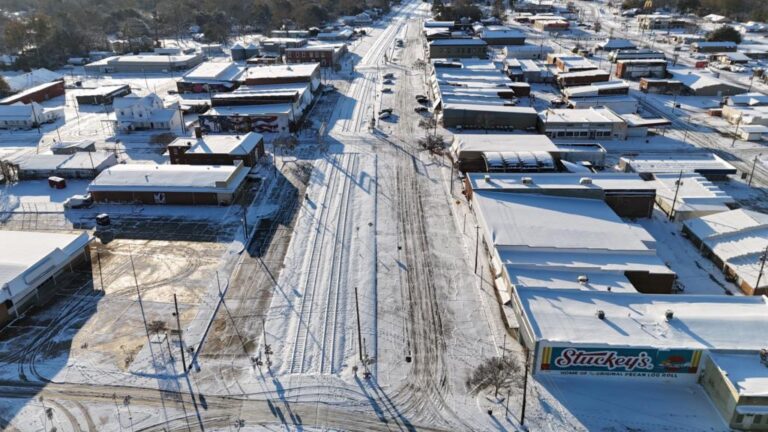 Aerial view of snow along the railroad corridor running through downtown Eastman