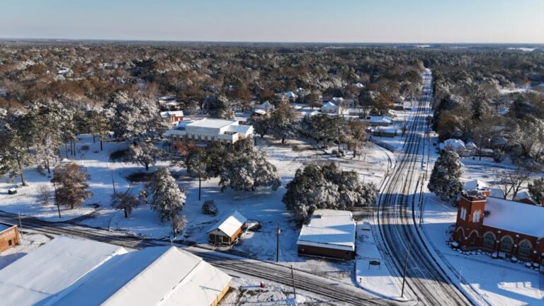 Aerial view of snow-covered trees and streets in Eastman